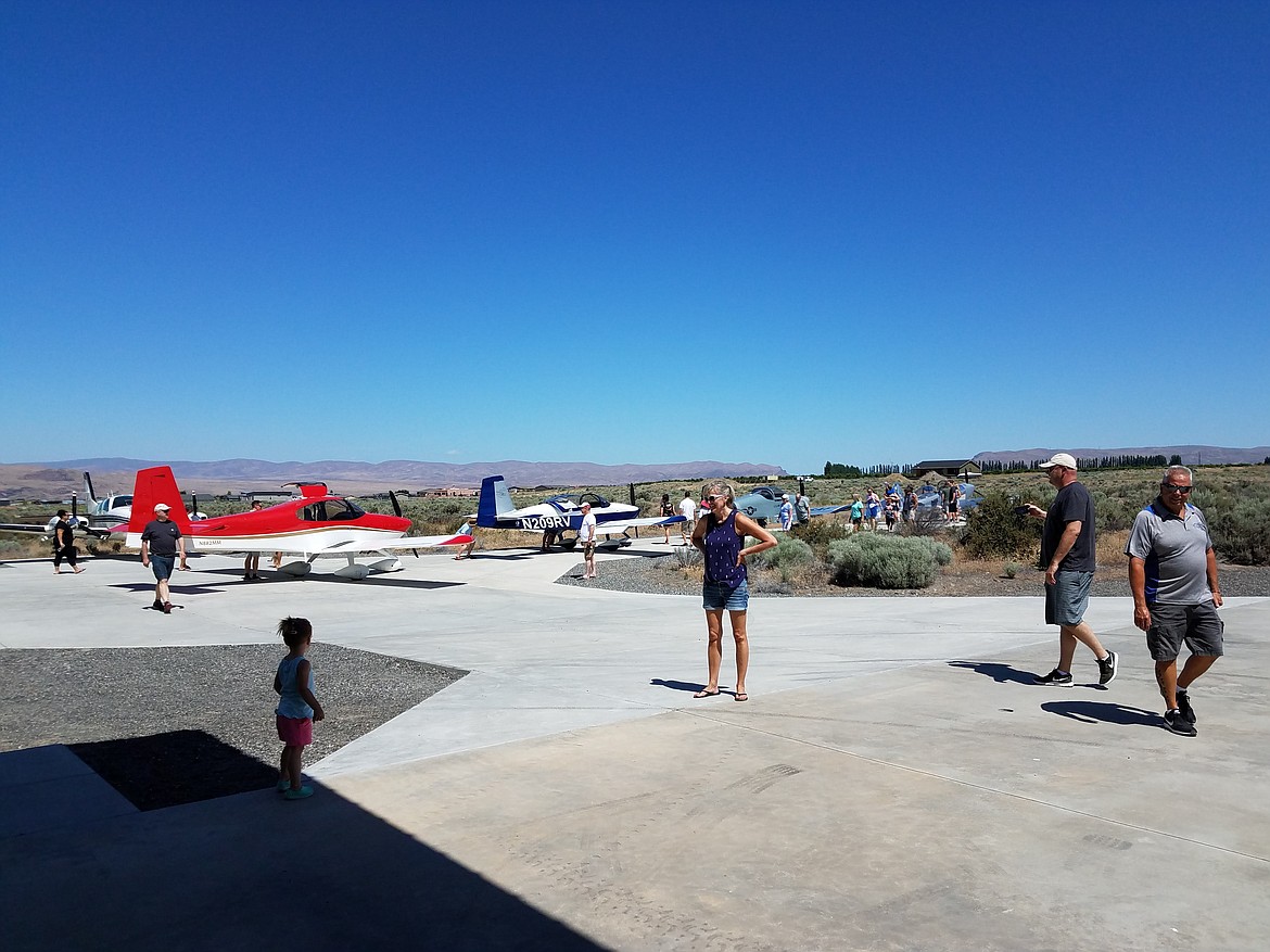 Airplanes are parked on the tarmac at the Desert Aire Airport during a 2023 fly-in event. If the Desert Aire Airport District is dissolved, the airport will remain open for public use