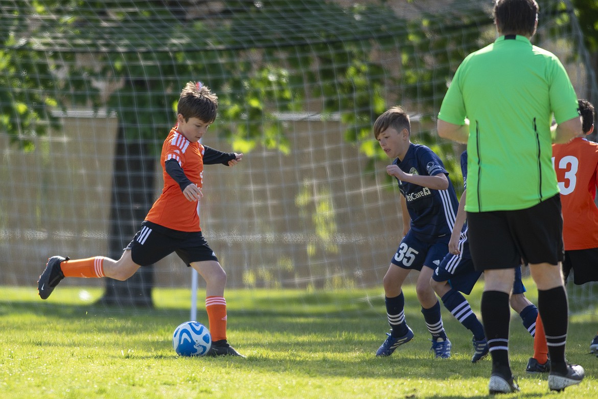 Courtesy photo
The FC North Idaho 2014 Orange soccer team beat the Spokane Sounders North 3-2 at Plantes Ferry Complex in Spokane. Pictured is Kash Tucker taking a shot on goal.