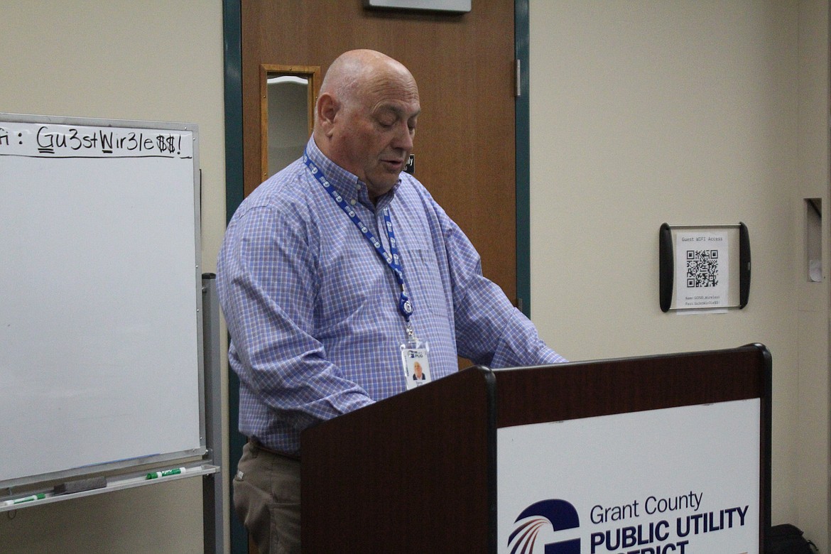 Grant County PUD Commissioner Terry Pyle reads a statement from the commissioners during Tuesday’s workshop.