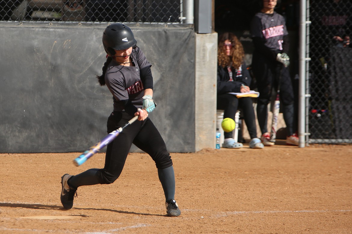 Almira/Coulee-Hartline freshman Grace Okamoto swings at a pitch during a game against Wellpinit on March 26. The Warriors finished the year with an 18-5 record, winning the Northeast 1B district championship.