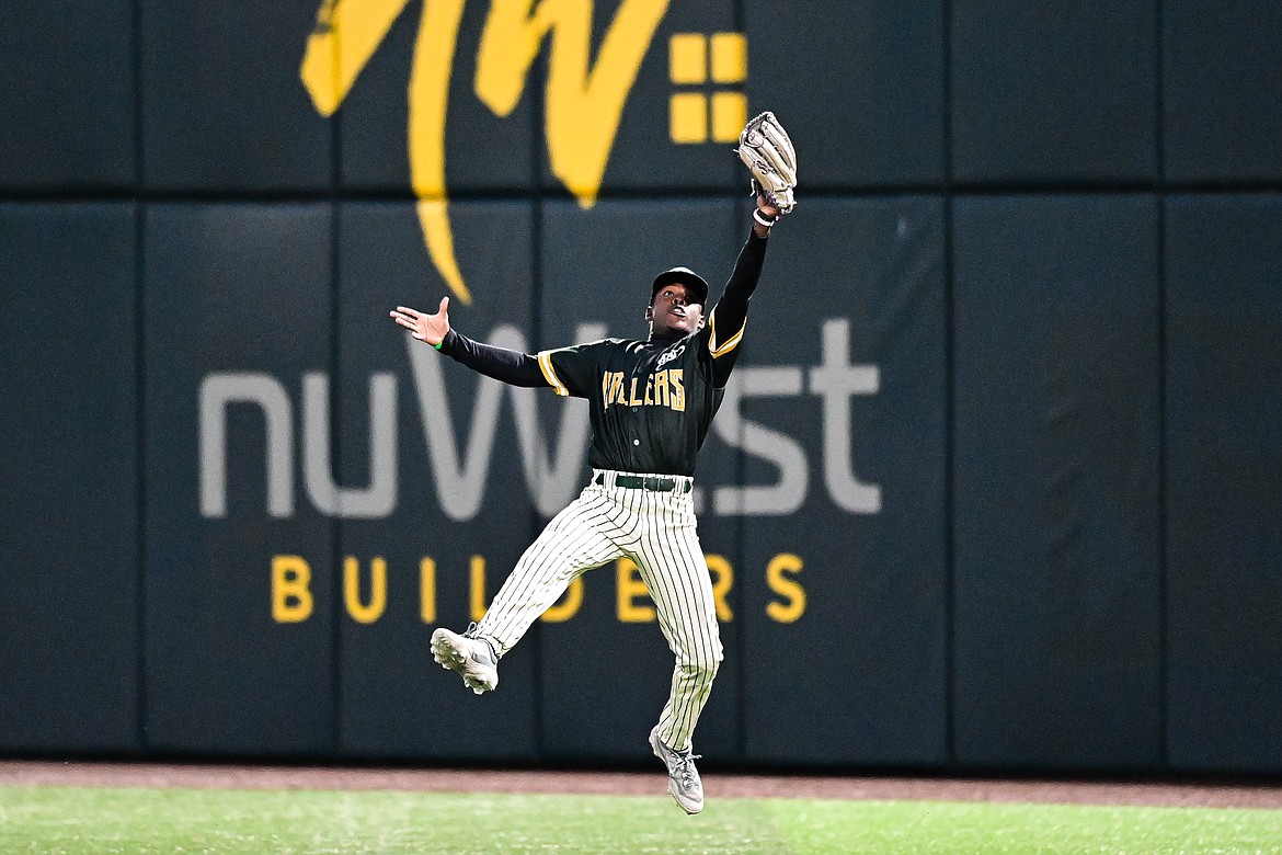 Oakland right fielder Austin Davis (21) makes a leaping catch against the Glacier Range Riders at Glacier Bank Park in Kalispell, Montana on Tuesday, May 21. (Casey Kreider/Daily Inter Lake)