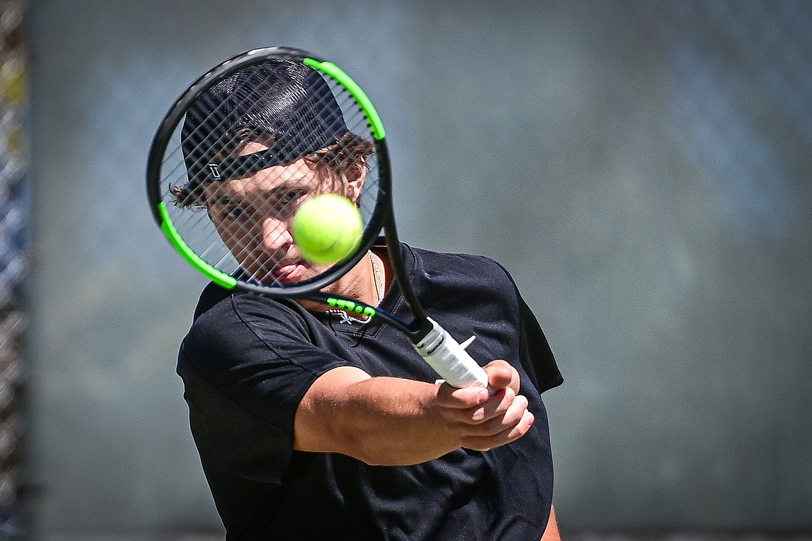 Whitefish's Mason Kelch hits a return in a boys doubles match with teammate Dane Hunt against Bigfork at Riverside Park in Whitefish on Thursday, May 9. (Casey Kreider/Daily Inter Lake)