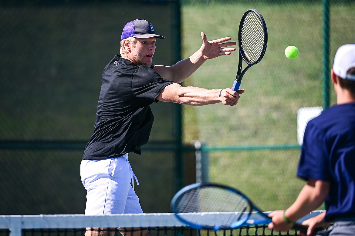 Polson's Otto Lund hits a return at the net in a boys doubles match with teammate Tate Barentsen against Dillon's Jon Hernandez-Puga and Carson Fluckiger at the Class A State Tennis Tournament at FVCC on Thursday, May 23. (Casey Kreider/Daily Inter Lake)