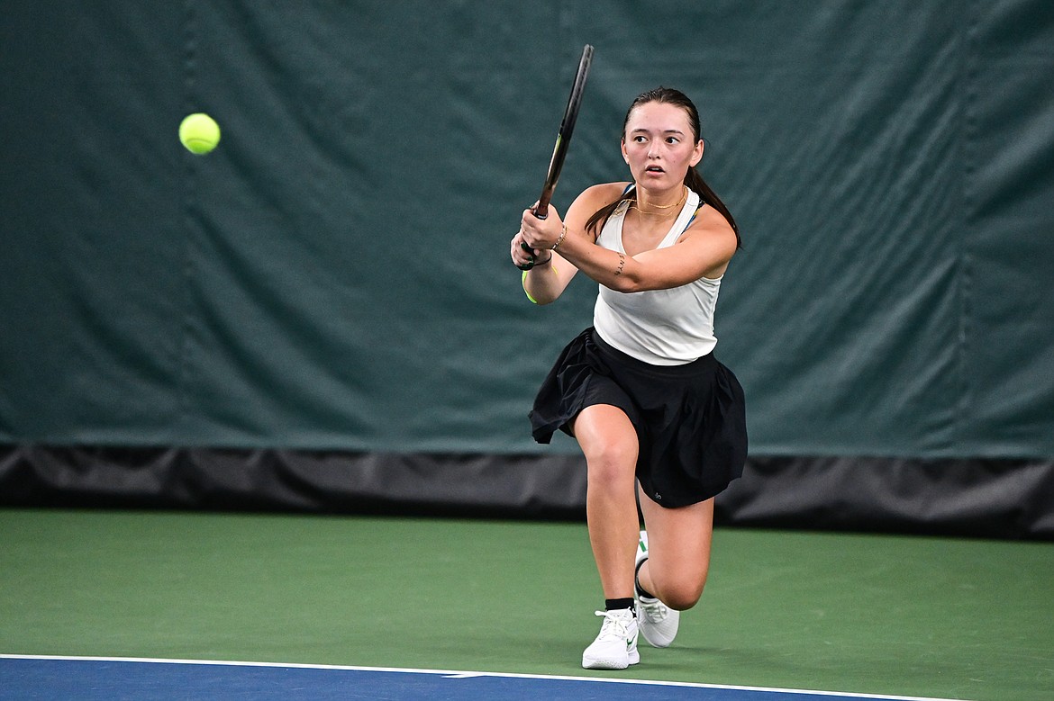 Whitefish's Alivia Lusko hits a return in a girls singles match against Hamilton's Tallulah Pinjuv at the Class A State Tennis Tournament at Logan Health Medical Fitness Center on Thursday, May 13. (Casey Kreider/Daily Inter Lake)