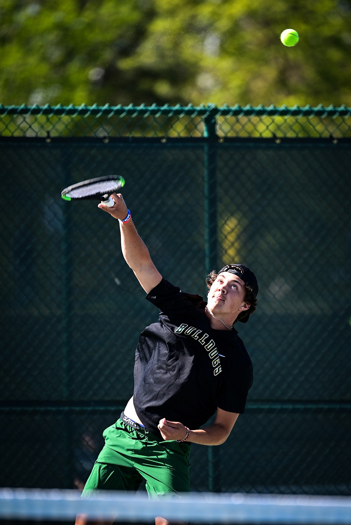 Whitefish's Mason Kelch serves in a boys doubles matchup with teammate Dane Hunt against Dillon's Isaac and Zach Sandall at the Class A State Tennis Tournament at FVCC on Thursday, May 23. (Casey Kreider/Daily Inter Lake)