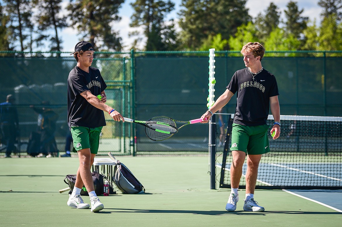 Whitefish's boys doubles pairing of Mason Kelch and Dane Hunt tap rackets between sets against Dillon's Isaac and Zach Sandall at the Class A State Tennis Tournament at FVCC on Thursday, May 23. (Casey Kreider/Daily Inter Lake)