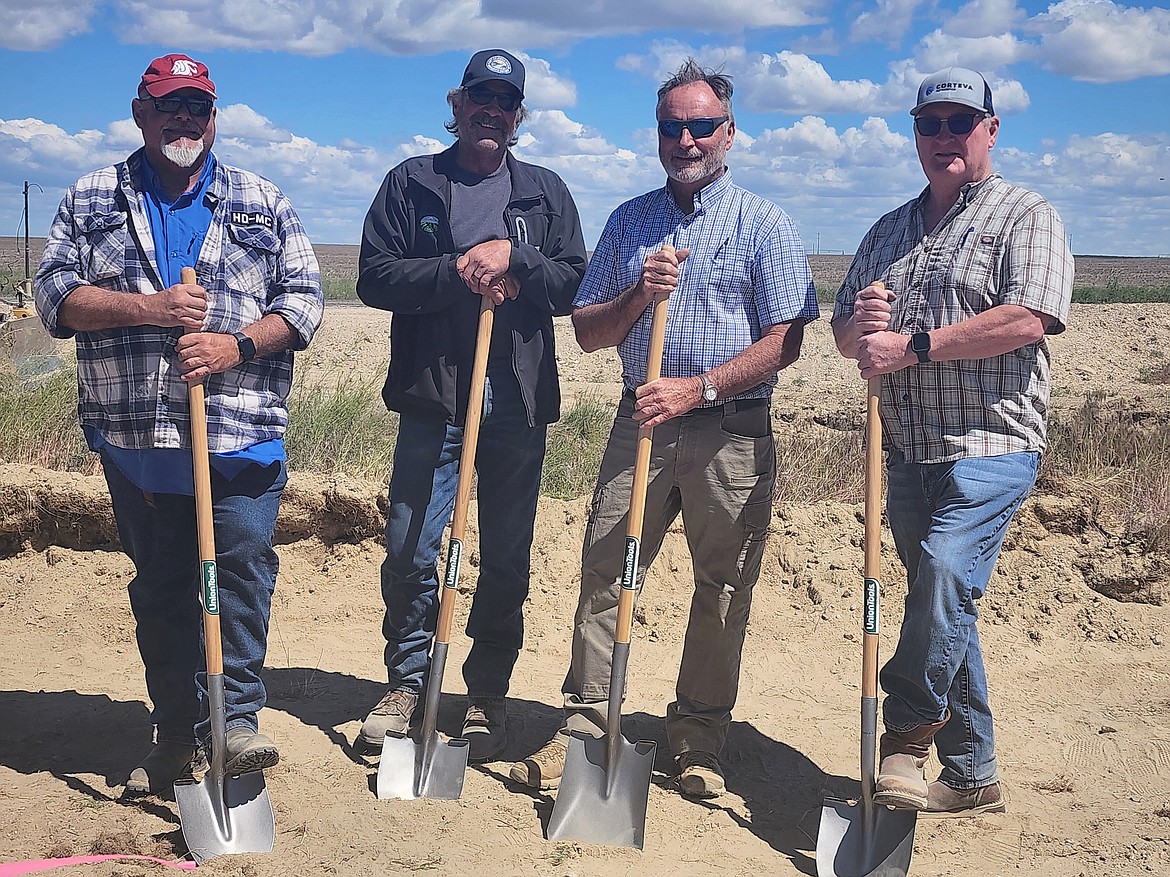 Members of the East Columbia Basin Irrigation District Board of Directors hold shovels at Monday’s groundbreaking ceremony for the EL 86.4 irrigation system.