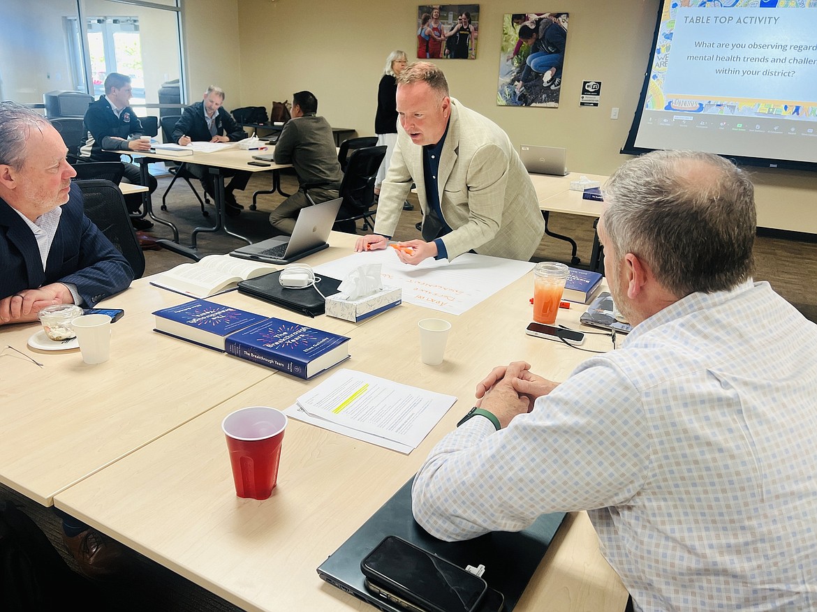 Wahluke School District Superintendent Andy Harlow, center, at a meeting last month hosted by Educational Service District 105.