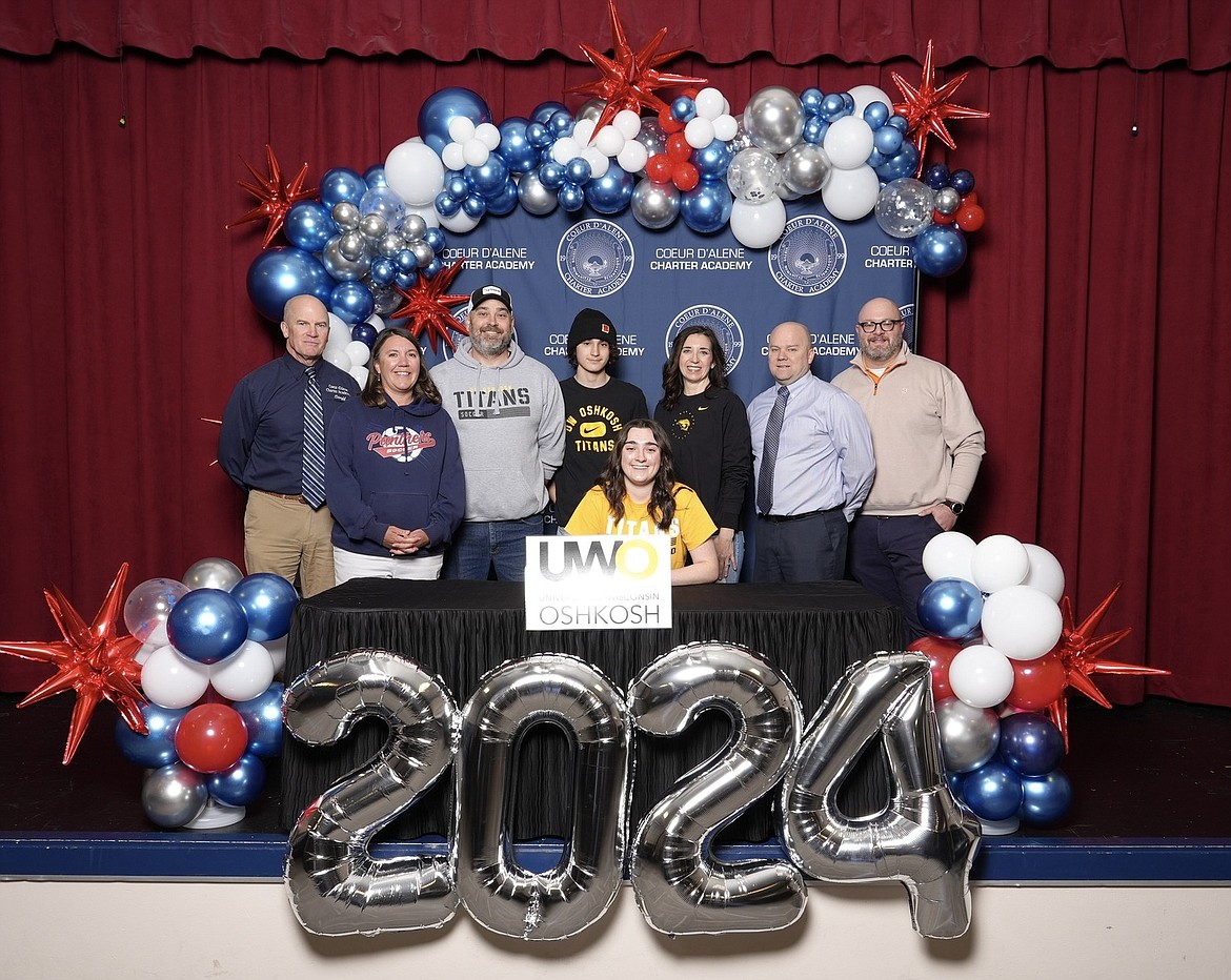 Courtesy photo
Coeur d'Alene Charter Academy senior Maddie Daigle recently signed a letter of intent to play soccer at NCAA Division III University of Wisconsin-Oshkosh. Seated is Maddie Daigle; and standing from left, Dan Nicklay, Coeur d'Alene Charter Academy principal; Stacy Smith, Coeur d'Alene Charter Academy head girls soccer coach; Craig Daigle, father; Jack Daigle, brother; Erin Daigle, mother; Aaron Lippy, Coeur d'Alene Charter Academy athletic director; and Trey Weatherly, Coeur d'Alene Charter Academy assistant girls soccer coach.