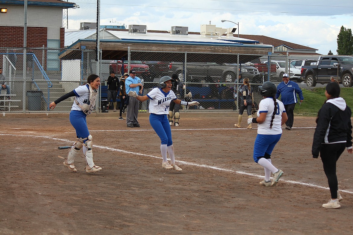Warden players celebrate after defeating Royal during a doubleheader earlier this season. The No. 6 seed Cougars take on No. 11 Lind-Ritzville/Sprague in the first round of the 2B State Softball Tournament on Friday.
