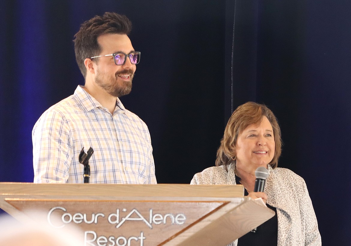 Justin Schorzman and Heidi Rogers address the crowd during the Celebration of Philanthropy luncheon at the Hagadone Event Center on Thursday.