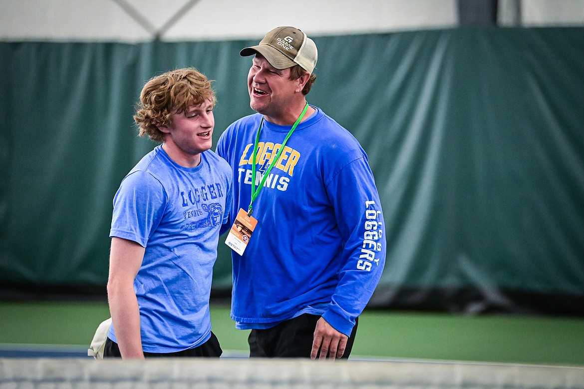 Libby's Ryan Beagle gets congratulated by Loggers coach Kyle Hannah after a win over Hamilton's Ryan Purcell at the Class A State Tennis Tournament at Logan Health Medical Fitness Center on Friday, May 24. (Casey Kreider/Daily Inter Lake)