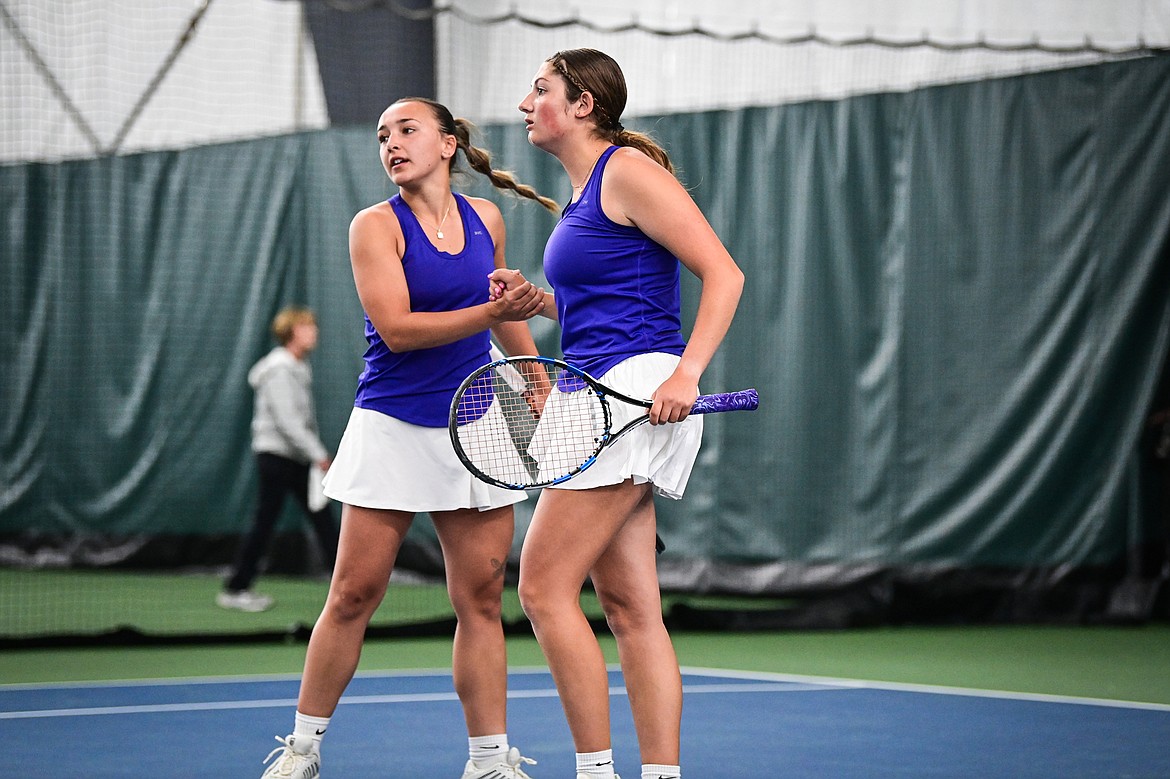 Polson's girls doubles pairing of Julia Barnard and Katelyn Smith celebrate after a point during a match against Hardin's Taiya Guptill and Johanna Limberhand at the Class A State Tennis Tournament at Logan Health Medical Fitness Center on Friday, May 24. (Casey Kreider/Daily Inter Lake)