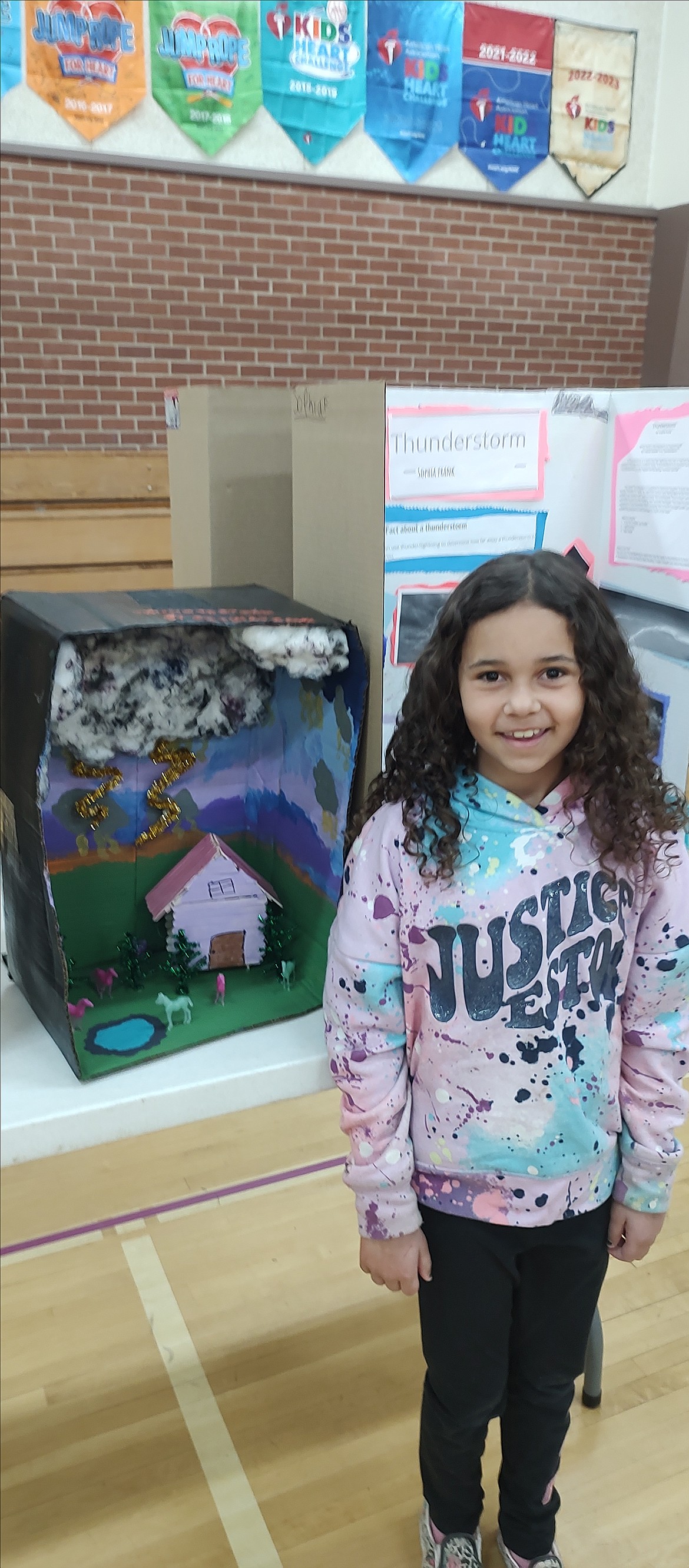 Sophia Frank presents her thunderstorm science fair exhibit.