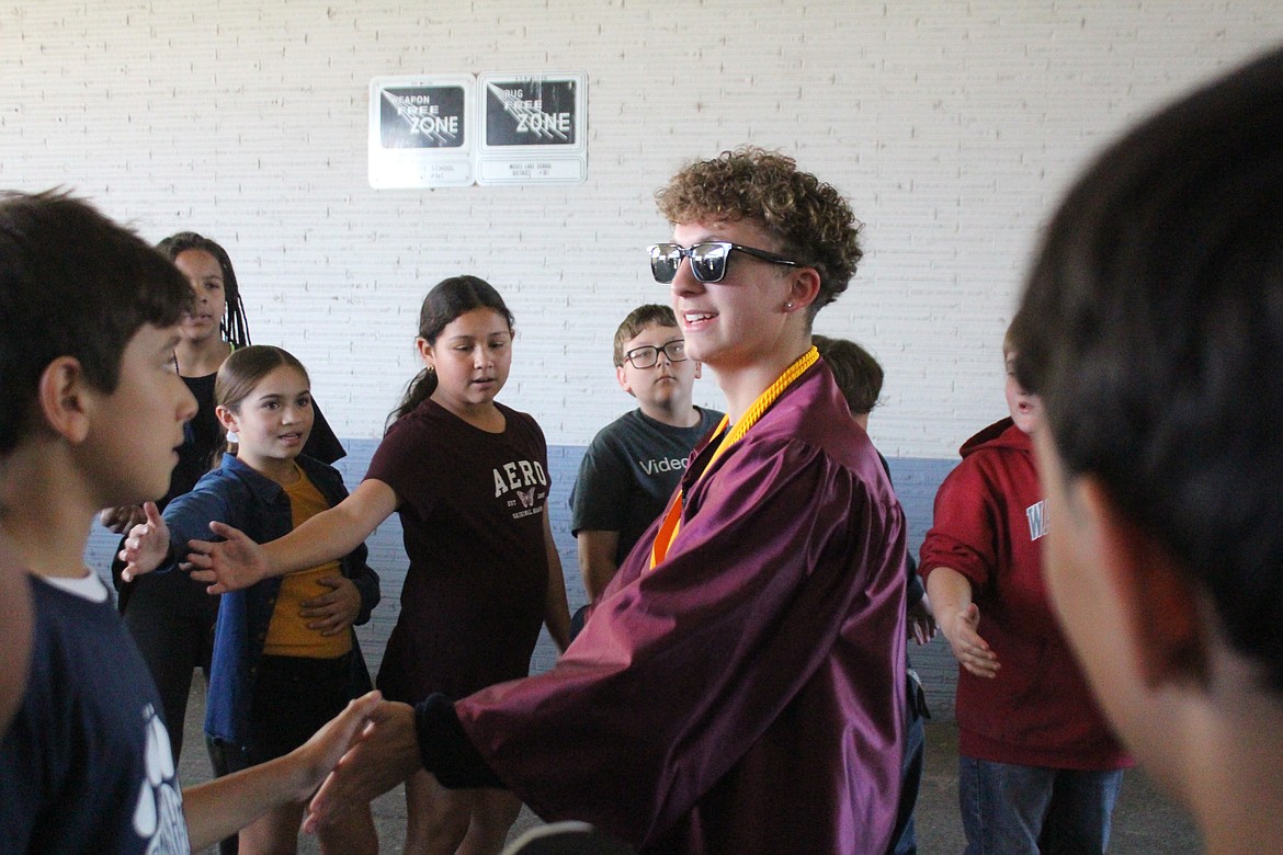 Moses Lake High School graduating seniors were congratulated by Peninsula Elementary students and wanted to send a message to their younger peers that they could do it too.