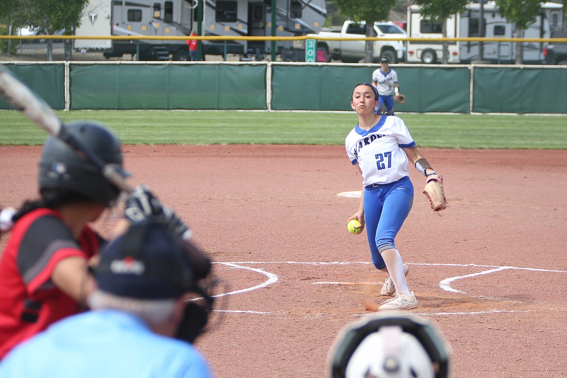 Warden pitcher Emma Cox (27) pitches against the Lind-Ritzville/Sprague Broncos on Friday in the opening round of the 2B State Softball Tournament. Cox had 14 strikeouts in the win.