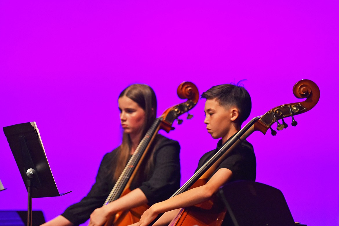7th grade bass players Bella Woodruff and Solas Noftsinger at the Whitefish Middle School Spring Orchestra concert. (Kelsey Evans/Whitefish Pilot)