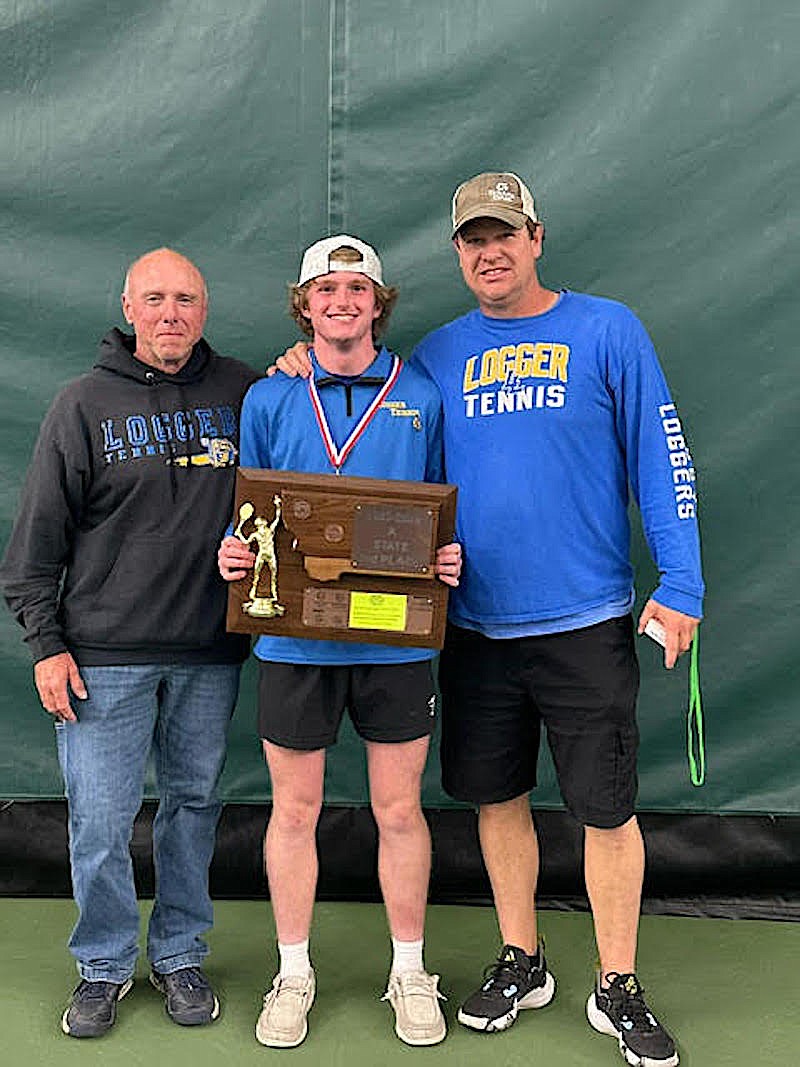 Libby's Terry Oedewaldt, Ryan Beagle and Kyle Hannah show off the gold medal and third-place team trophy after Beagle beat Polson's Torin Ellis to win the Montana Class A tennis singles championships Friday, May 24, 2024. (Scott Shindledecker/The Western News)