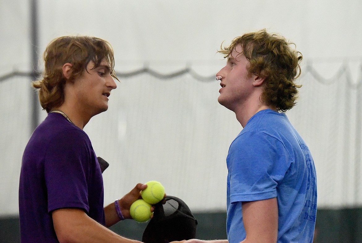 Libby's Ryan Beagle and Polson's Torin Ellis meet at midcourt after Beagle won the Montana Class A tennis singles championships Friday, May 24, 2024. (Scott Shindledecker/The Western News)