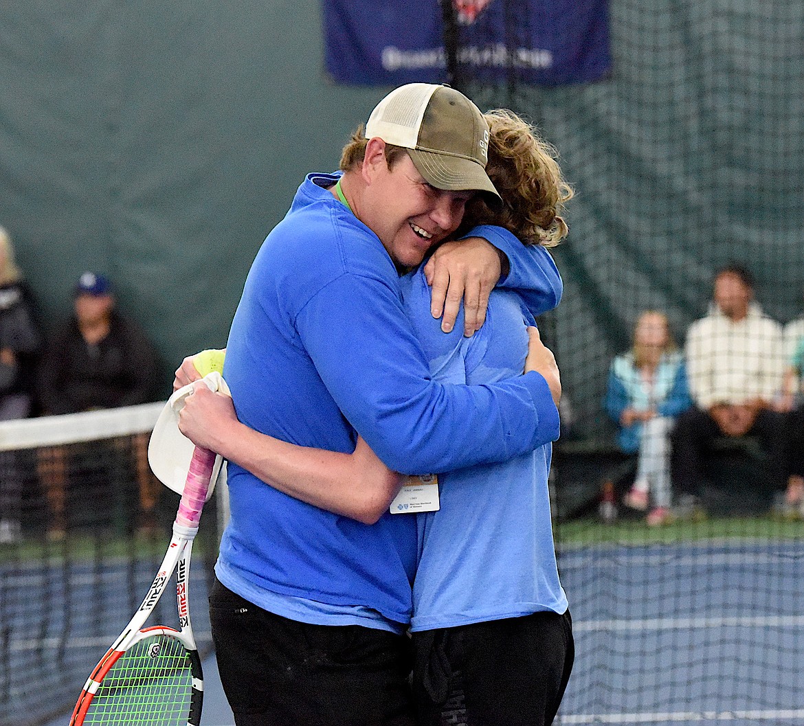 Libby's Ryan Beagle and Loggers head coach Kyle Hannah hug after Beagle beat Polson's Torin Ellis to win the Montana Class A tennis singles championships Friday, May 24, 2024. (Scott Shindledecker/The Western News)