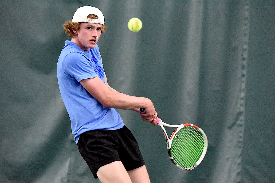 Libby's Ryan Beagle back hands a shot against Polson's Torin Ellis in the state Class A singles championships Friday, May 24, 2024. (Scott Shindledecker/The Western News)