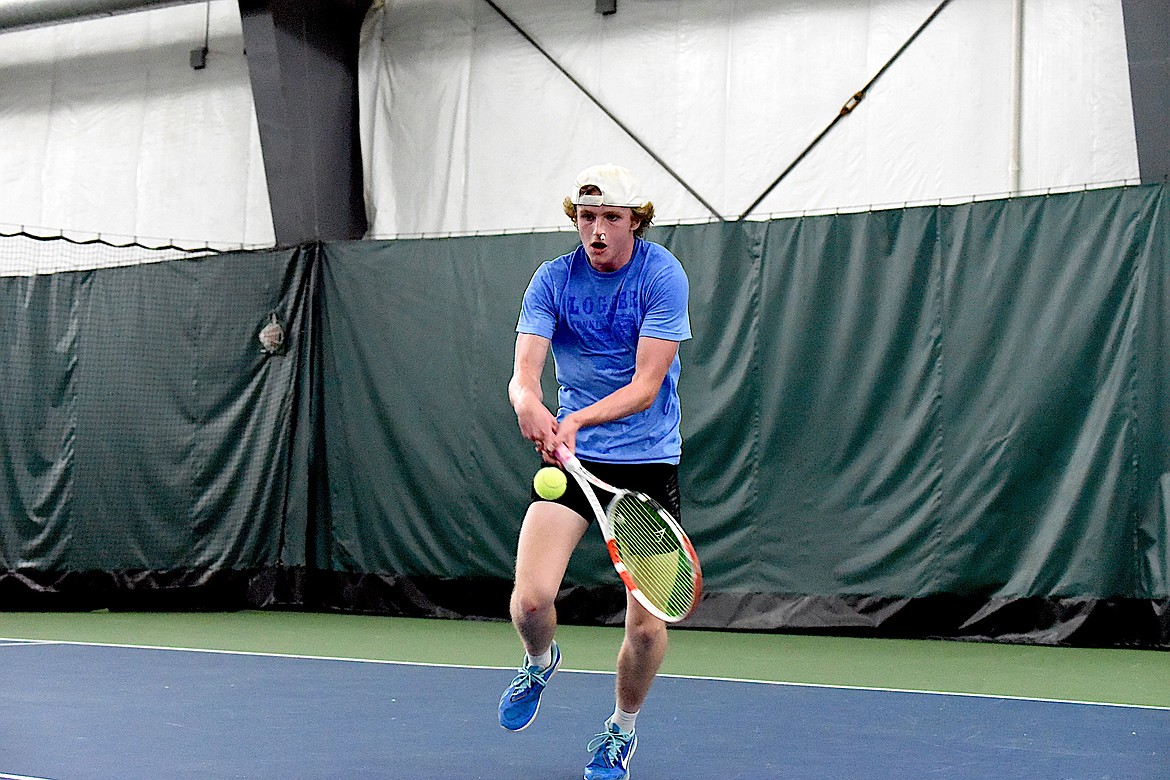 Libby's Ryan Beagle hustles to return a shot against Polson's Torin Ellis in the state Class A singles championships Friday, May 24, 2024. (Scott Shindledecker/The Western News)