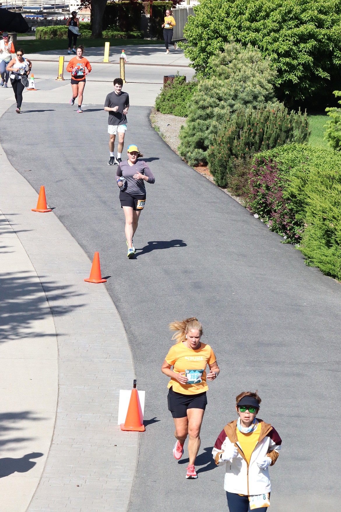 Runners follow a path into McEuen Park on Sunday.