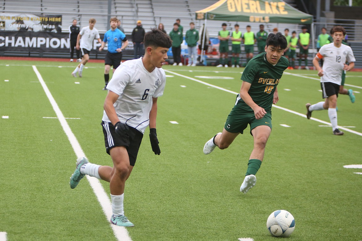 Royal sophomore Ernesto Deras (6) brings the ball upfield during the first half of the 1A boys soccer state championship game on Saturday in Renton.