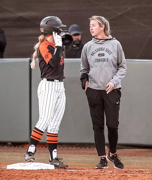 Courtesy Oklahoma State Athletics
Vanessa Shippy-Fletcher, right, chats with an Oklahoma State runner at first base.