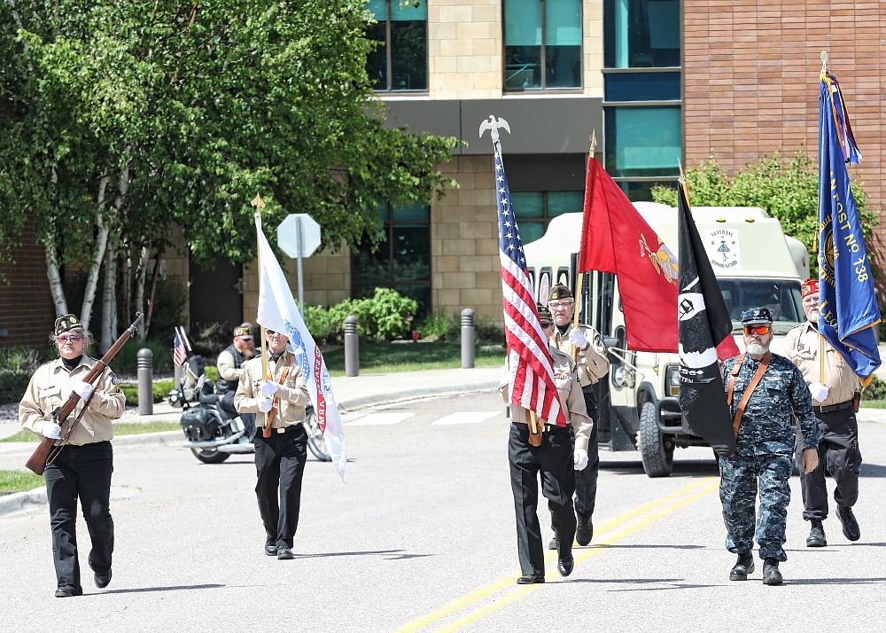 Honor Guard marches through downtown Ronan on Memorial Day, following a procession in Polson. The group of veterans also offered a 21-gun salute at cemeteries in both communities. (Susan Lake photo)