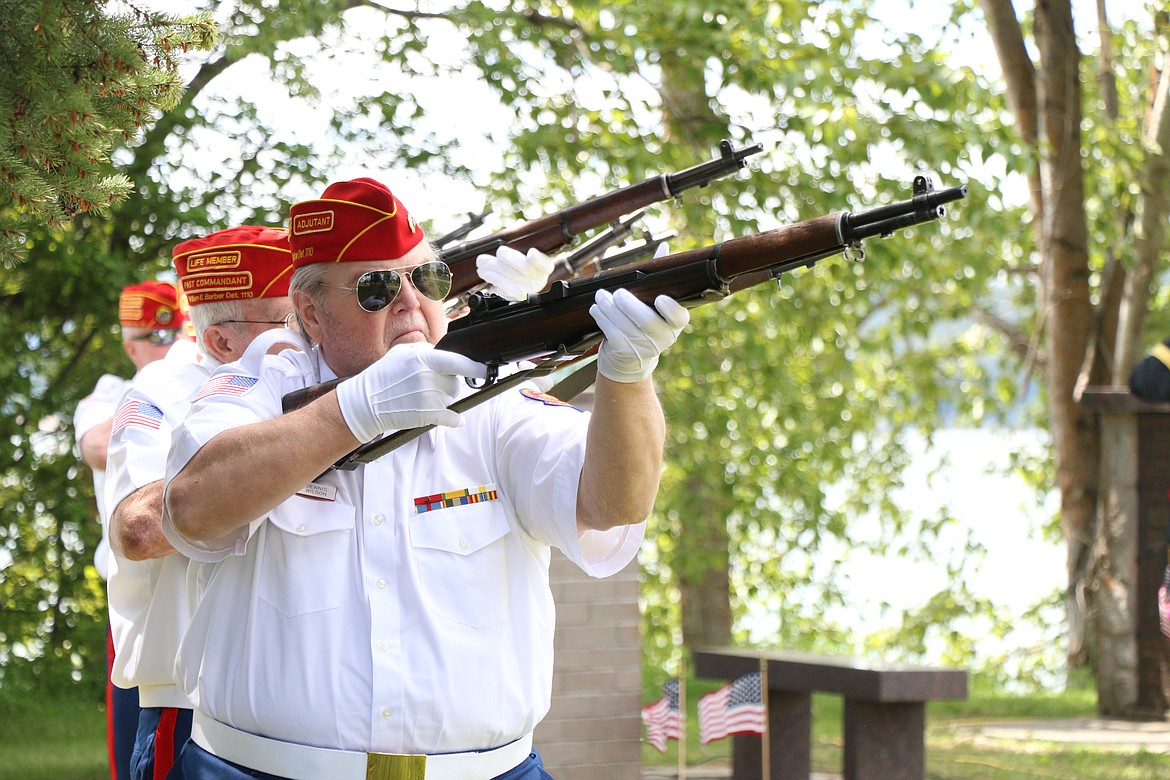 Marine Corps League members fire off a volley as part of a 21-gun salute at a Memorial Day service at Lakeview Cemetery as they honor those who gave their lives in service to the United States.