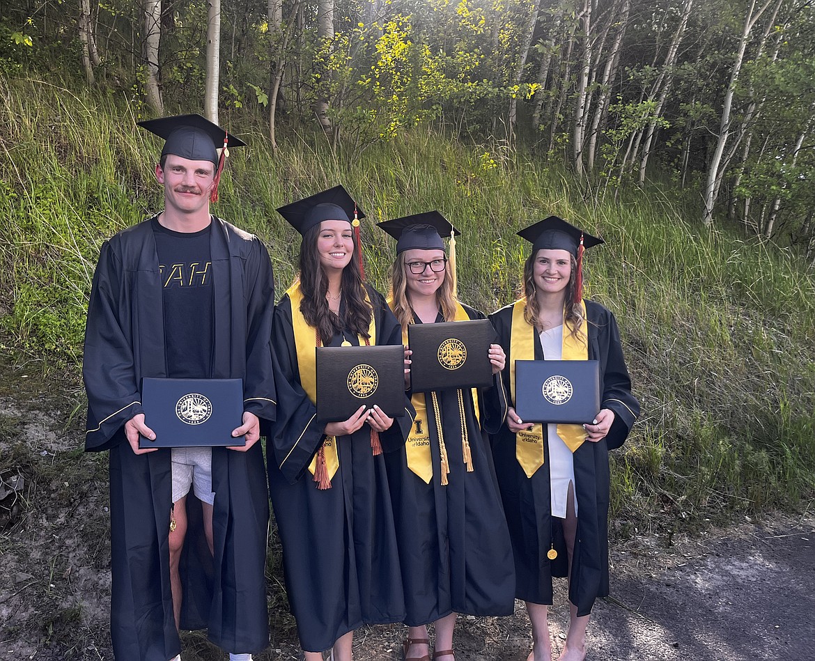 University of Idaho graduates Bradley O’Brien, Heather Pound, Amy Flack, and Shayla Martinez pose with their diplomas after their recent graduation.