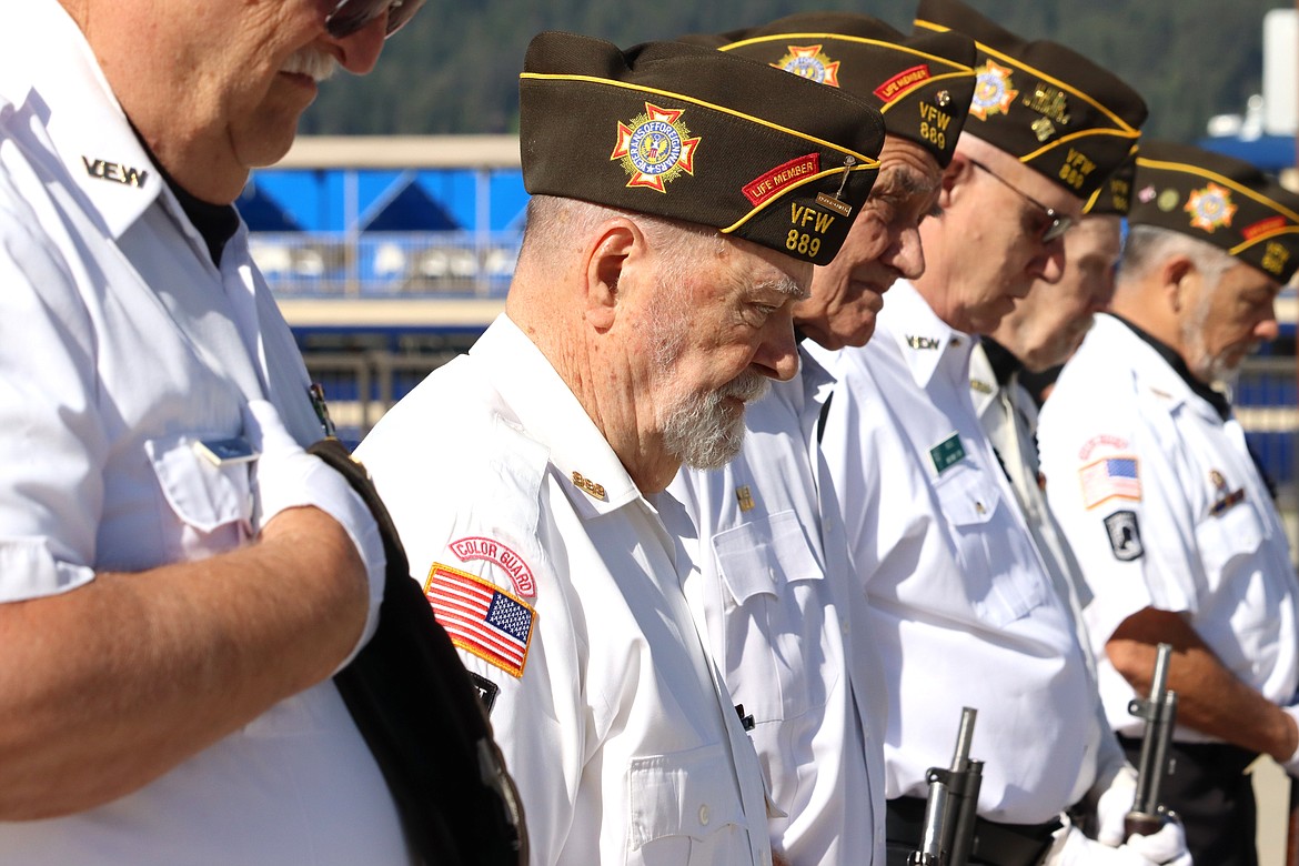 Veteran Bob Banta, second from left, participates in a Memorial Day ceremony Monday.