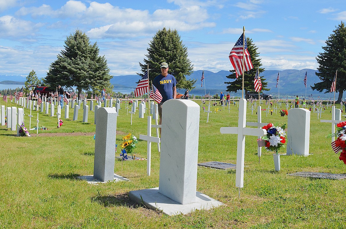 Flags flew atop veterans' graves at Lake View Cemetery in Polson on Memorial Day – a tribute undertaken each year by volunteers. (Kristi Niemeyer/Leader)