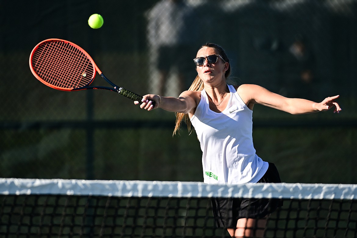 Whitefish's Maggie Mercer hits a return in a girls doubles match with teammate Ainsley Scott against Lewistown's Lexi Breidenbach and Lauren Plagenz at the Class A State Tennis Tournament at FVCC on Thursday, May 13. (Casey Kreider/Daily Inter Lake)