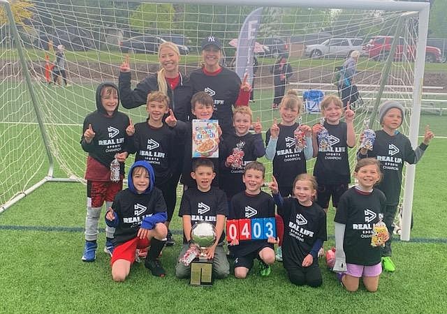 Courtesy photo
The Cannon Balls won the 1st/2nd Grade Cereal Cup championship in soccer for Real Life Sports. In the front row from left are Ryan Lettau, Elias Castro, Joseph Wirick, Lexi Rees and Savannah Marrujo; second row from left, Travis Lettau, Mason Butler, Lincoln Sargent, Jakob Clinton, Madison Malone, Makena Malone and Walker Matuszak; and back row from left, coaches Erika Sargent and Heather Malone.