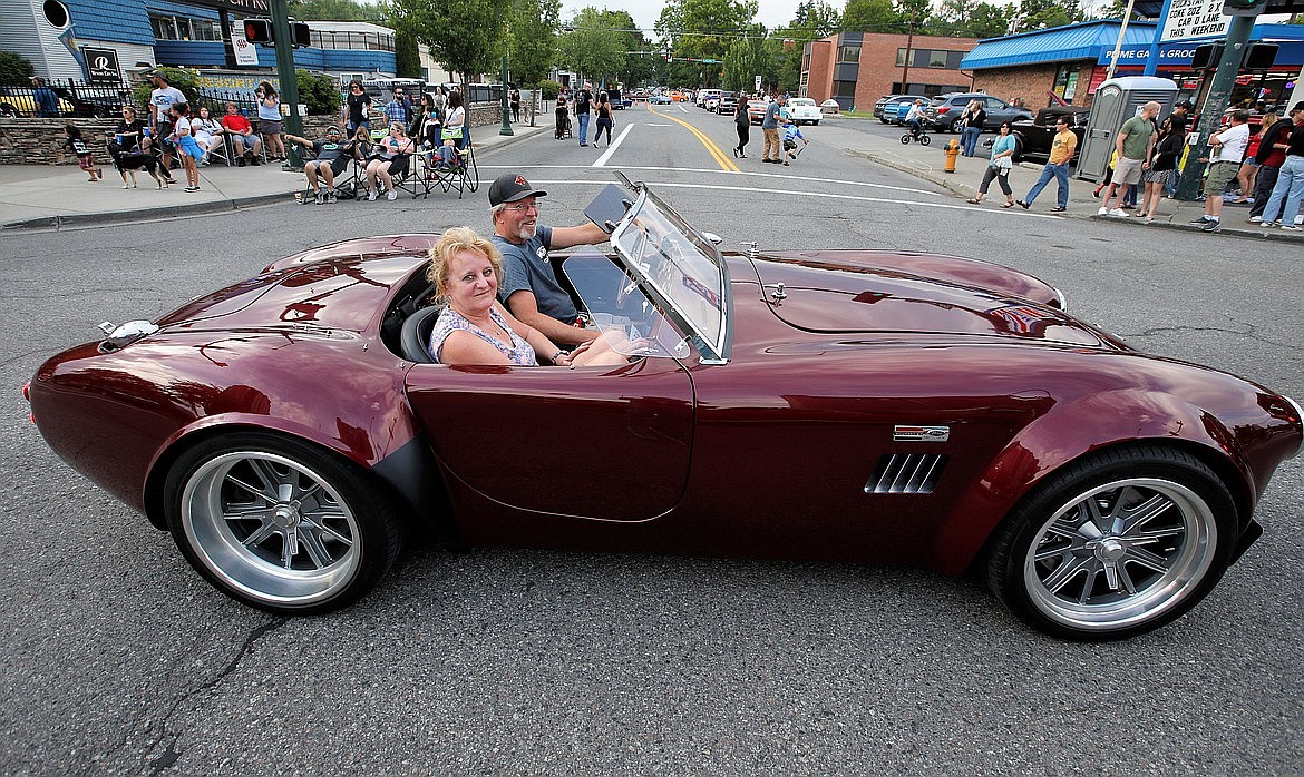 Chris and Suzanne Zabriskie ride in their 1965 Shelby Cobra in Car d'Lane.