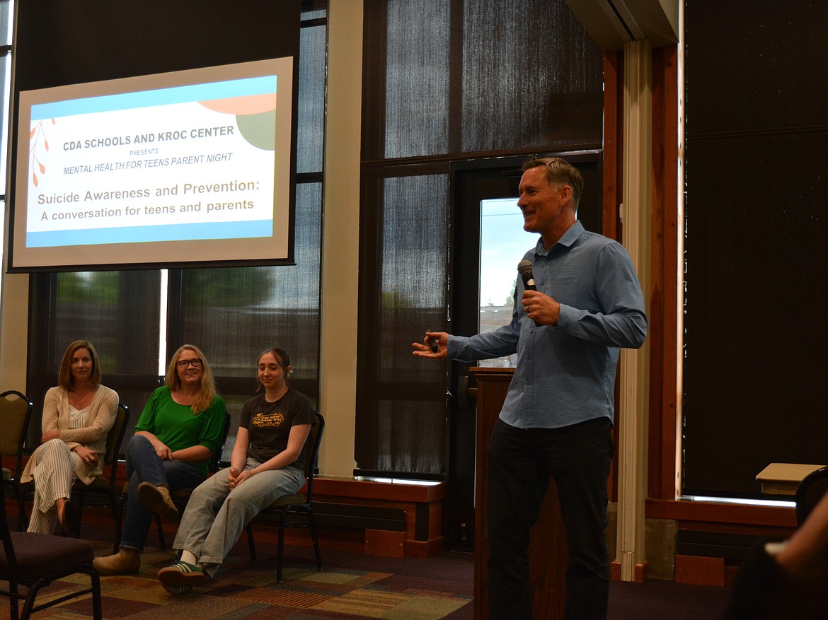 Keith Orchard introduces a talk at the Kroc Center on teen suicide awareness and prevention tools Tuesday night.
Seated left to right: Heather Hamilton, Melissa Sharon and Emma Sharon.