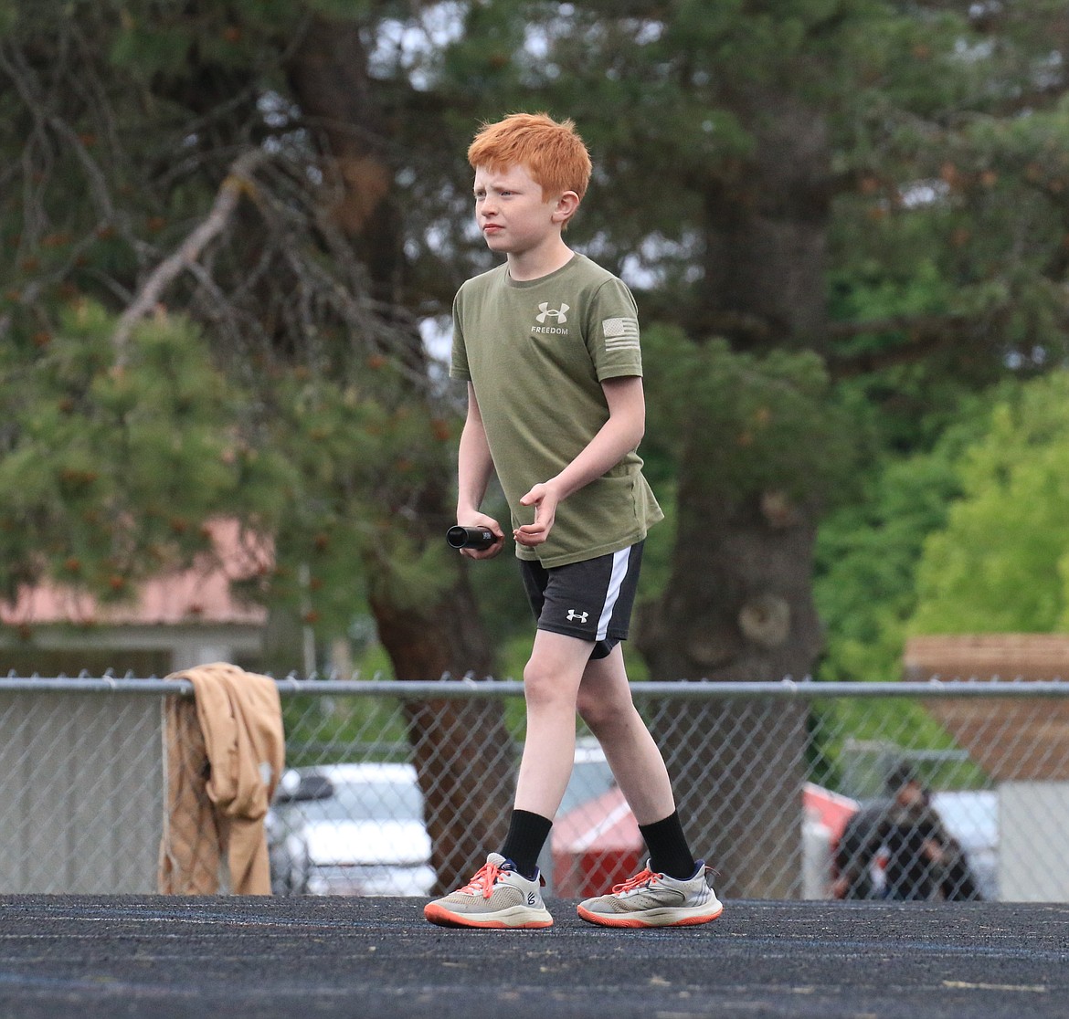 Harper Fields, a fourth-grader at Northside Elementary School, gets ready to lead off the boys' 4x100 relay. Fields won the broad jump and placed second in the 100-meter dash.