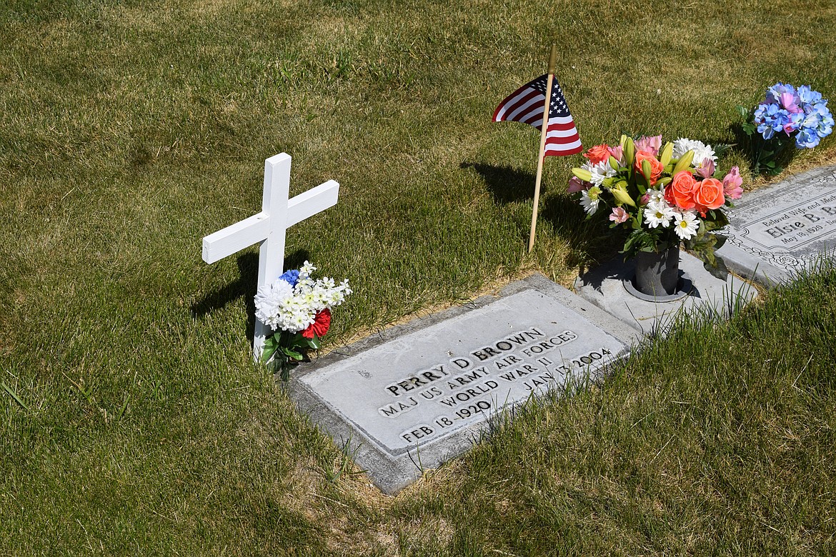 The grave of U.S. Army Air Forces Major and World War II veteran Perry D. Brown is decorated for Memorial Day on Monday.