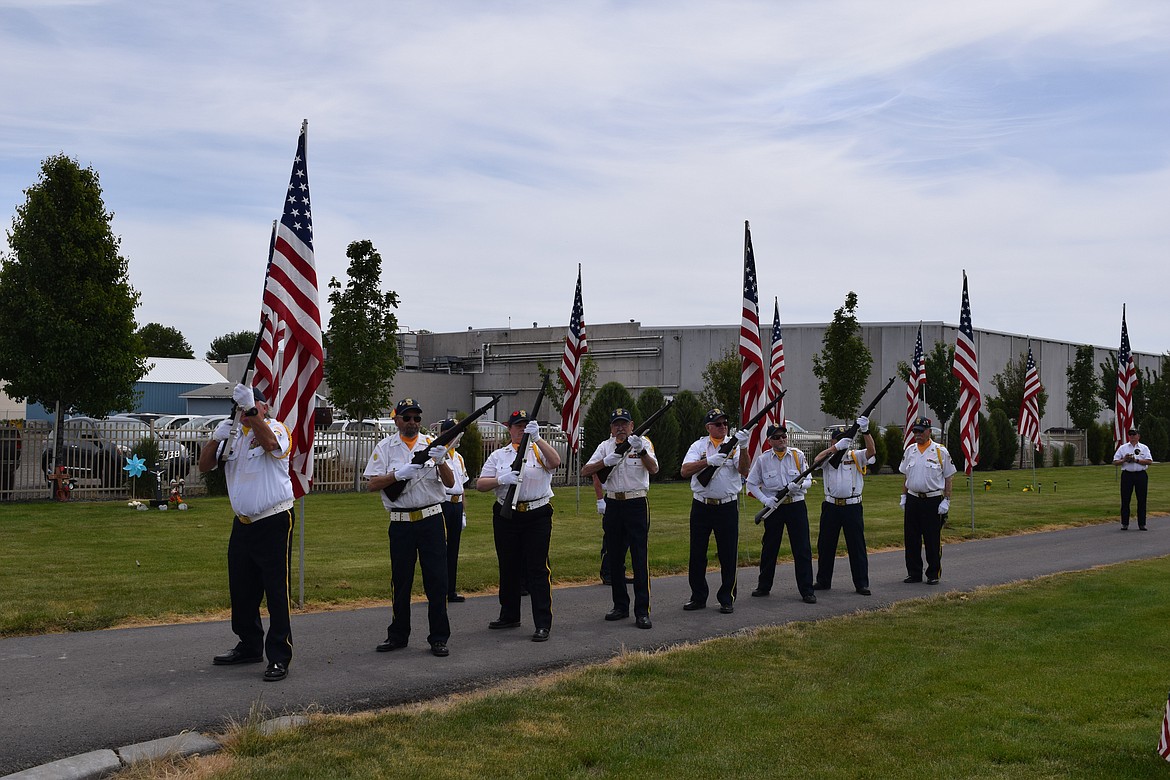 American Legion Art Semro Post 28 Honor Guard members fire their rifles during the Quincy ceremony. While American Legion Post 183 organized that event, the posts worked together to ensure full honors were observed.