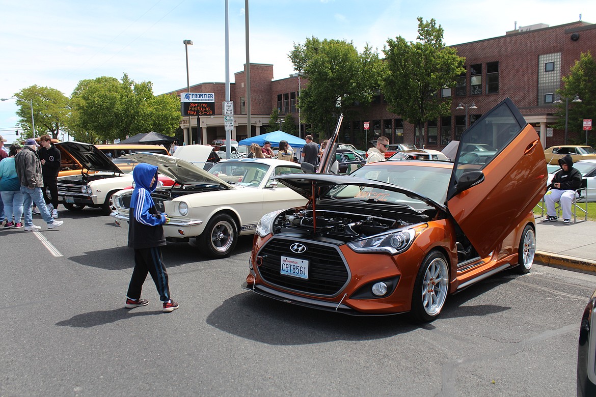 A 2016 Hyundai, a 1965 Mustang and a 1951 MG (the red car behind the Mustang) were examples of the wide array of cars, trucks, motorcycles and tractors at the Spring Festival car show.