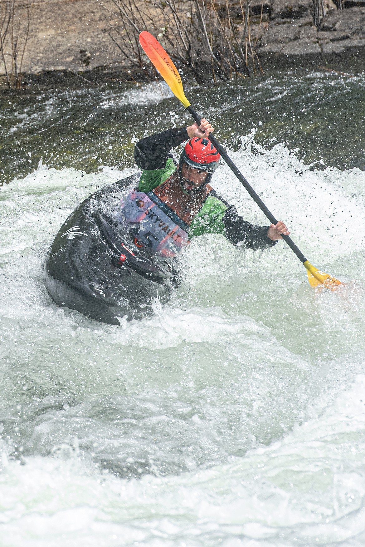 A kayaker competes in Giant Slalom at the Bigfork Whitewater Festival Sunday, May 26. (Avery Howe/Bigfork Eagle)