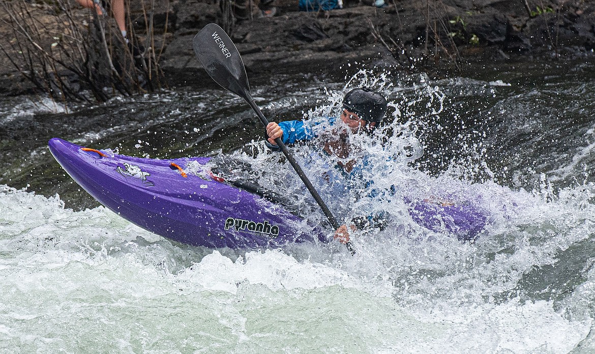 A kayaker competes in giant slalom at the Bigfork Whitewater Festival Sunday, May 26. (Avery Howe/Bigfork Eagle)