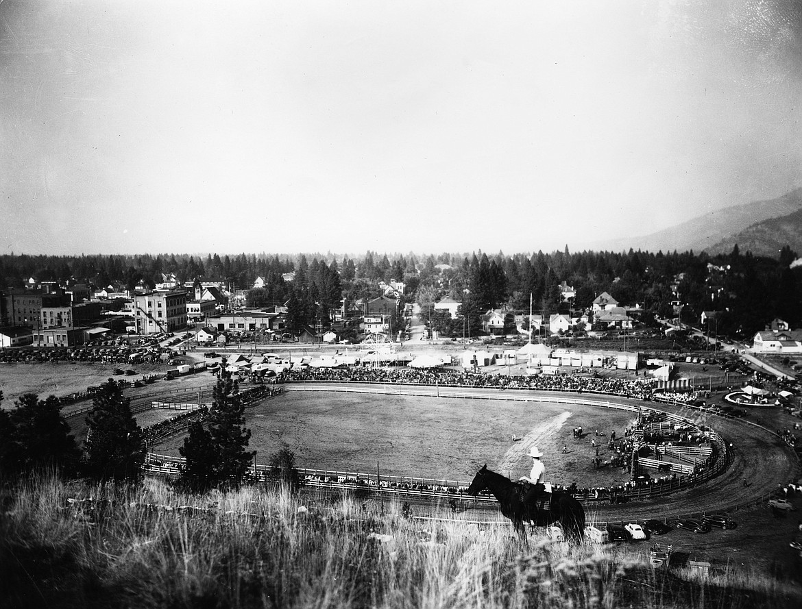 In this image taken around 1940 from Tubbs Hill, you can see the Coeur d'Alene Rodeo Grounds which used to be on the same location where McEuen Field sits today.