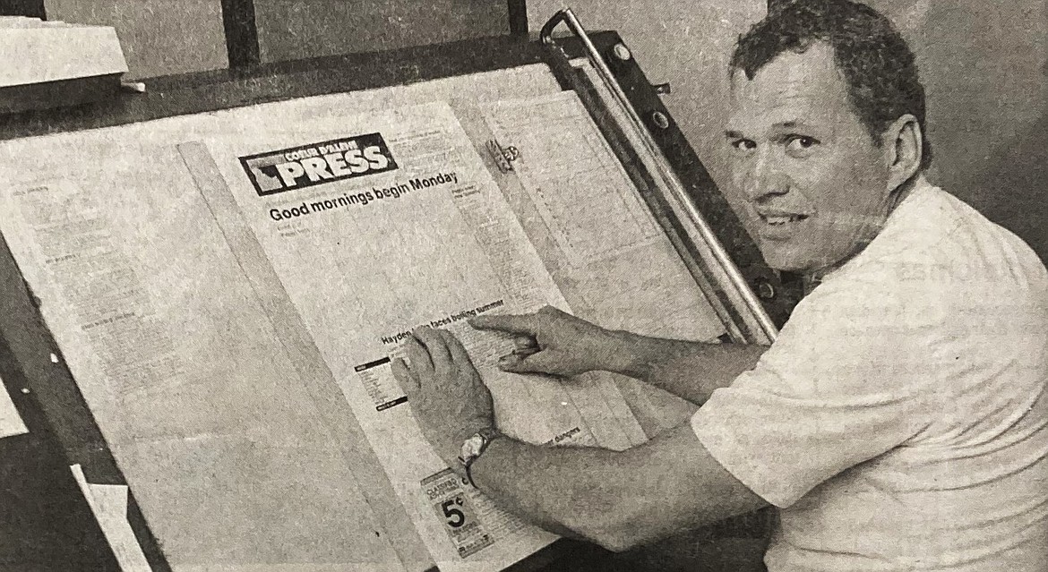 Composing room foreman Dave Walter pastes up the front page of the final evening edition of the Coeur d’Alene Press.