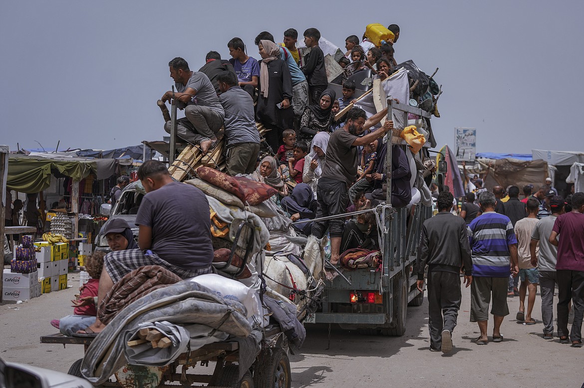 Palestinians fleeing from the southern Gaza city of Rafah during an Israeli ground and air offensive in the city on Tuesday, May 28, 2024. (AP Photo/Abdel Kareem Hana)