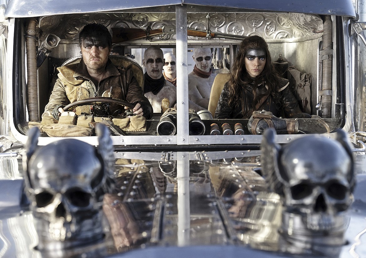 This image released by Warner Bros. Pictures shows Tom Burke, left, and Anya Taylor-Joy in a scene from "Furiosa: A Mad Max Saga."