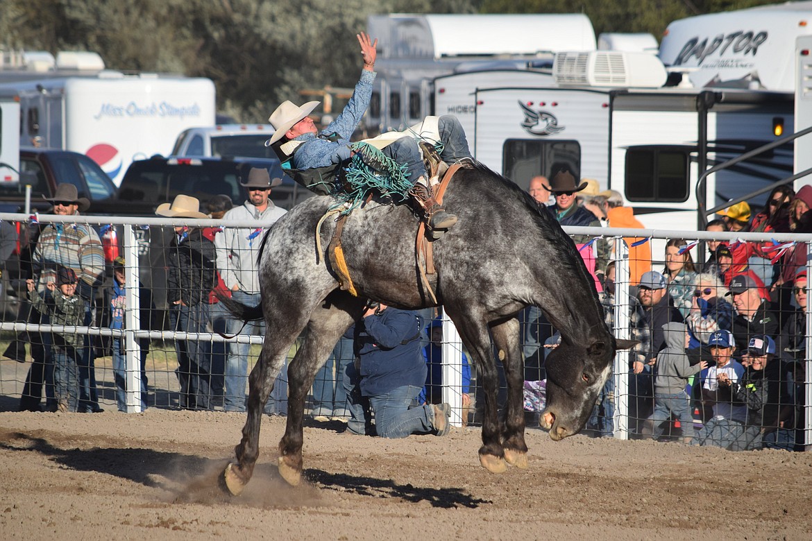 Hunter Greenup of Lexington, Oregon, competes in the bareback competition Saturday evening at the 2024 Last Stand Rodeo at the Coulee City Fairgrounds.