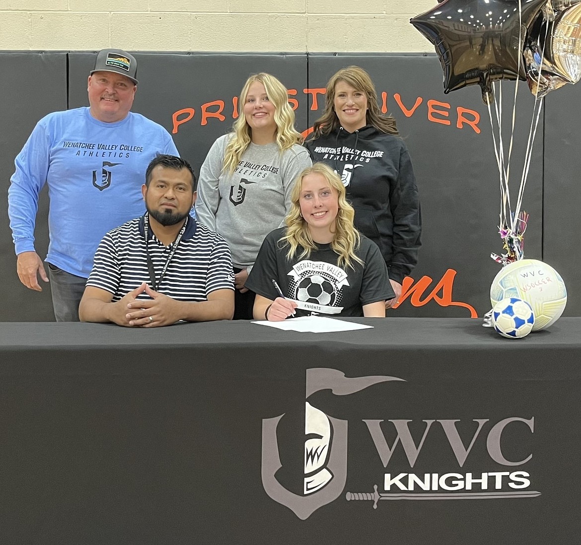 Priest River's Marley Burgess-Duquette signed to play girls soccer at Wenatchee Valley College (NWAC) in Wenatchee, Wash. Pictured alongside Markey is WVC head coach Pablo Rodriguez Jorge. Back row, from left, are Jeremy Burgess (father), Mckinley Burgess-Duquette (sister), and Trinity Duquette (mother). During her senior season, Marley scored 10 goals and dished out two assists to receive 3A All-Intermountain League honors. Her most notable outings came in wins over Grangeville and Newport, where she scored two goals each. Marley was also a two-time 2A state qualifier in the pole vault and played small forward for the varsity basketball team during her time at Priest River.